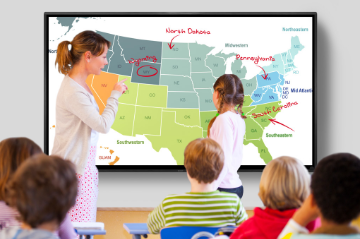 Teacher at Sharp 4T-B70CT1U AQUOS BOARD collaboration display showing student where States are located on a map 